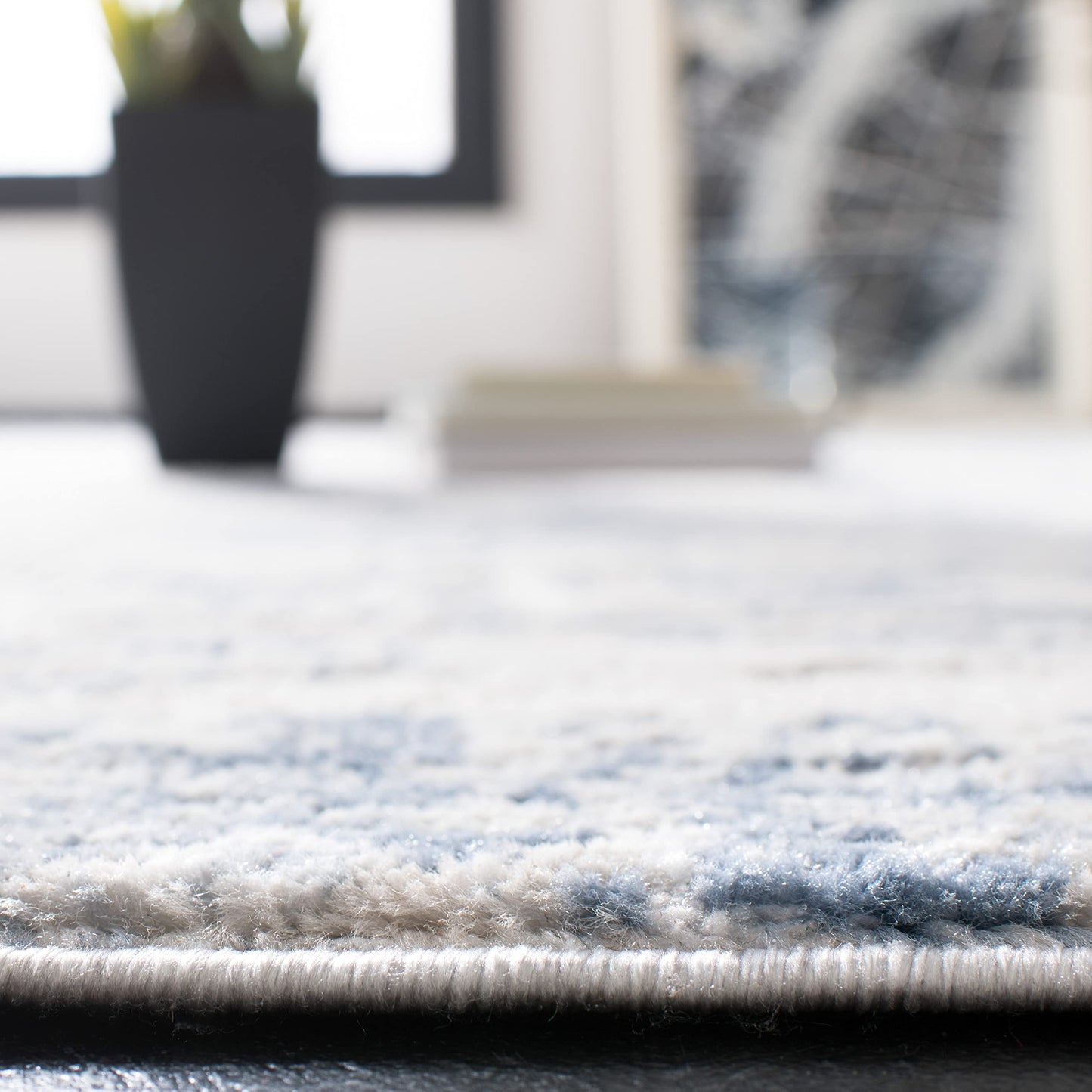 SAFAVIEH Amelia Collection Area Rug - 6' x 9', Ivory & Blue, Modern Abstract Design, Non-Shedding & Easy Care, Ideal for High Traffic Areas in Living Room, Bedroom (ALA700A)