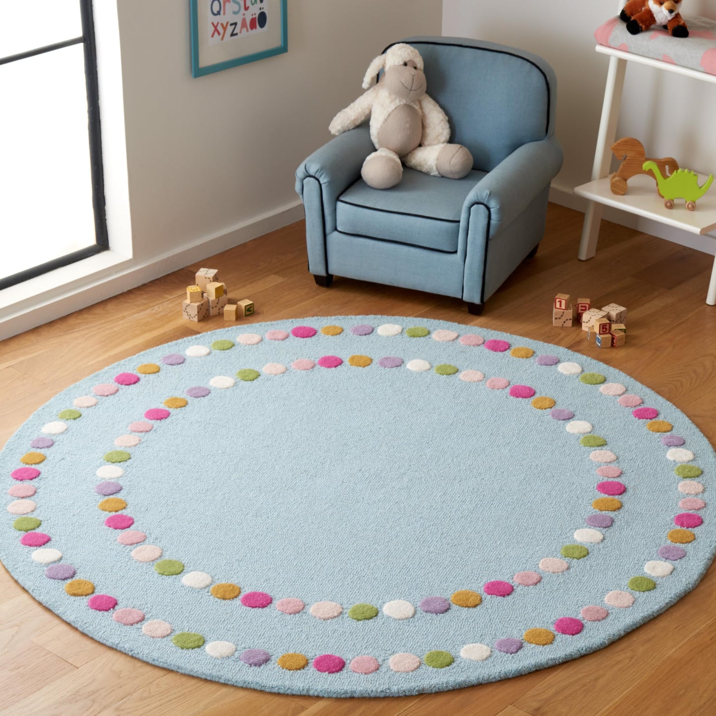 SAFAVIEH Kids Collection Area Rug - 5' Round, Blue & Pink, Polka Dot Border Design, Handmade Wool, Ideal for the Kids Room, Playroom, Nursery (SFK928M-5R)