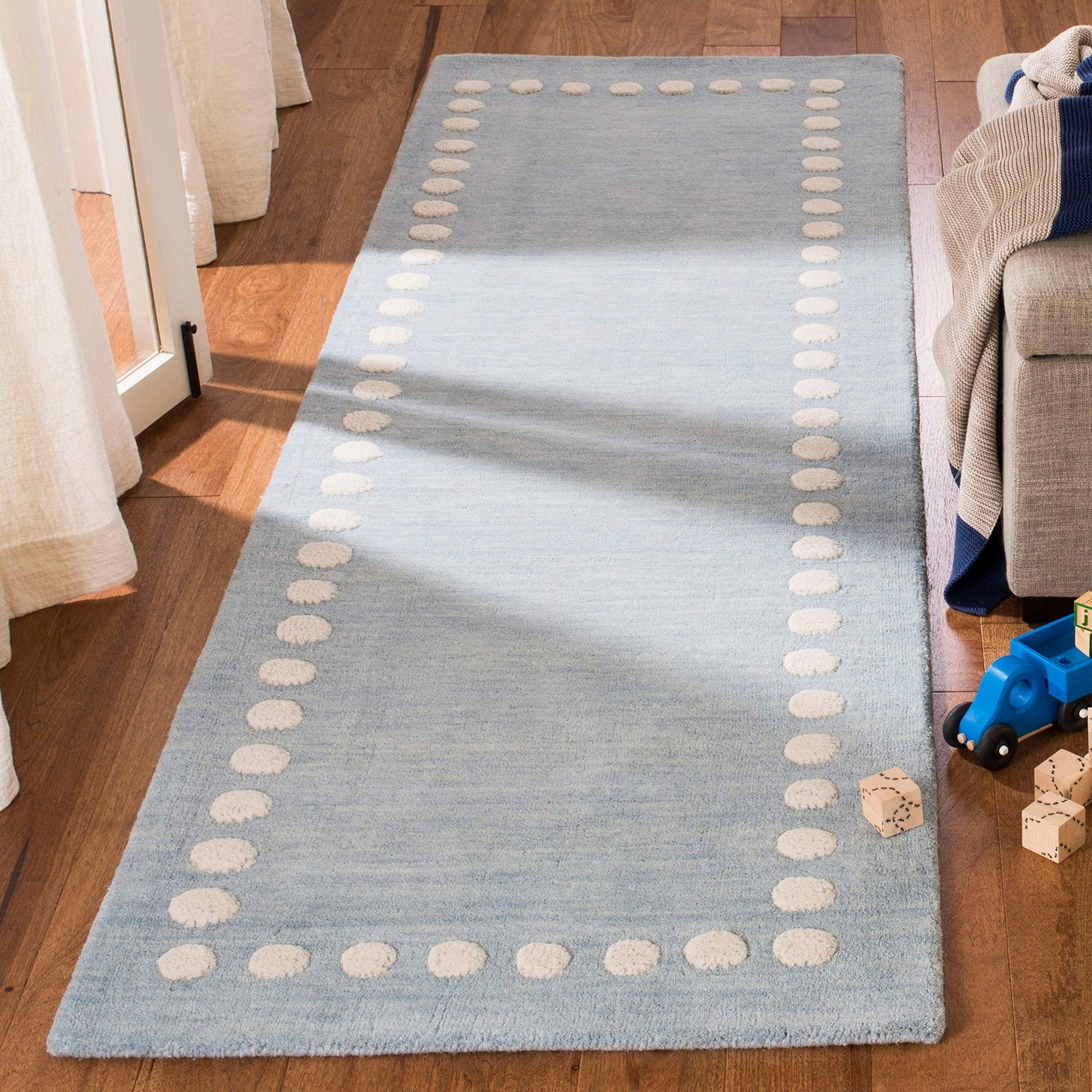 SAFAVIEH Kids Collection Accent Rug - 3' x 5', Blue & Ivory, Handmade Polka Dot Border Wool, Ideal for High Traffic Areas in Entryway, Living Room, Bedroom (SFK802M)