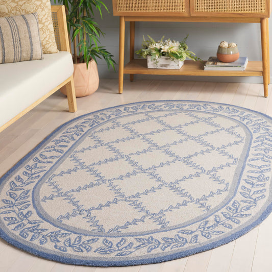 SAFAVIEH Chelsea Collection Area Rug - 4'6" x 6'6" Oval, Ivory & Light Blue, Hand-Hooked French Country Wool, Ideal for High Traffic Areas in Living Room, Bedroom (HK230A)