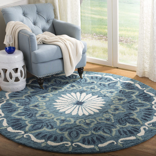 SAFAVIEH Novelty Collection Area Rug - 6' Round, Blue & Ivory, Handmade Boho Wool, Ideal for High Traffic Areas in Living Room, Bedroom (NOV602M)