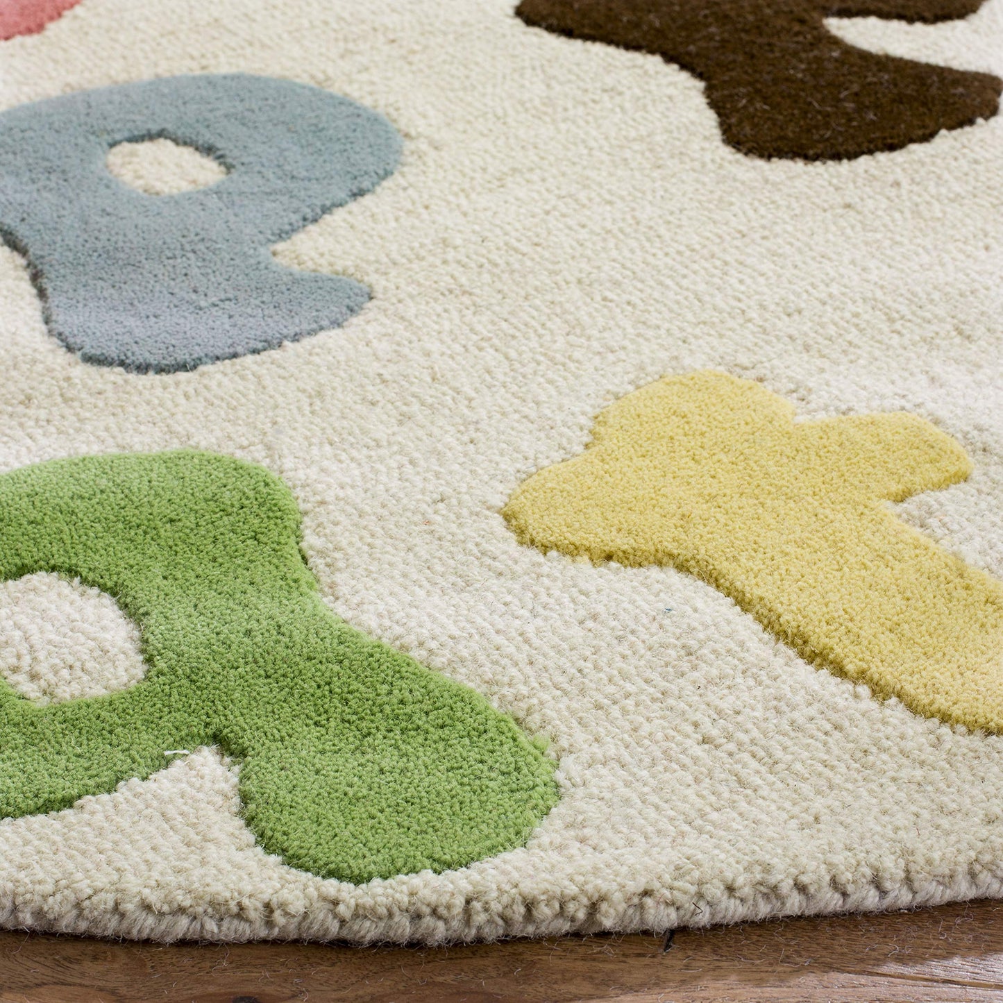 SAFAVIEH Kids Collection 4' Round Ivory/Multi SFK389A Handmade Alphabet Letters Wool Area Rug