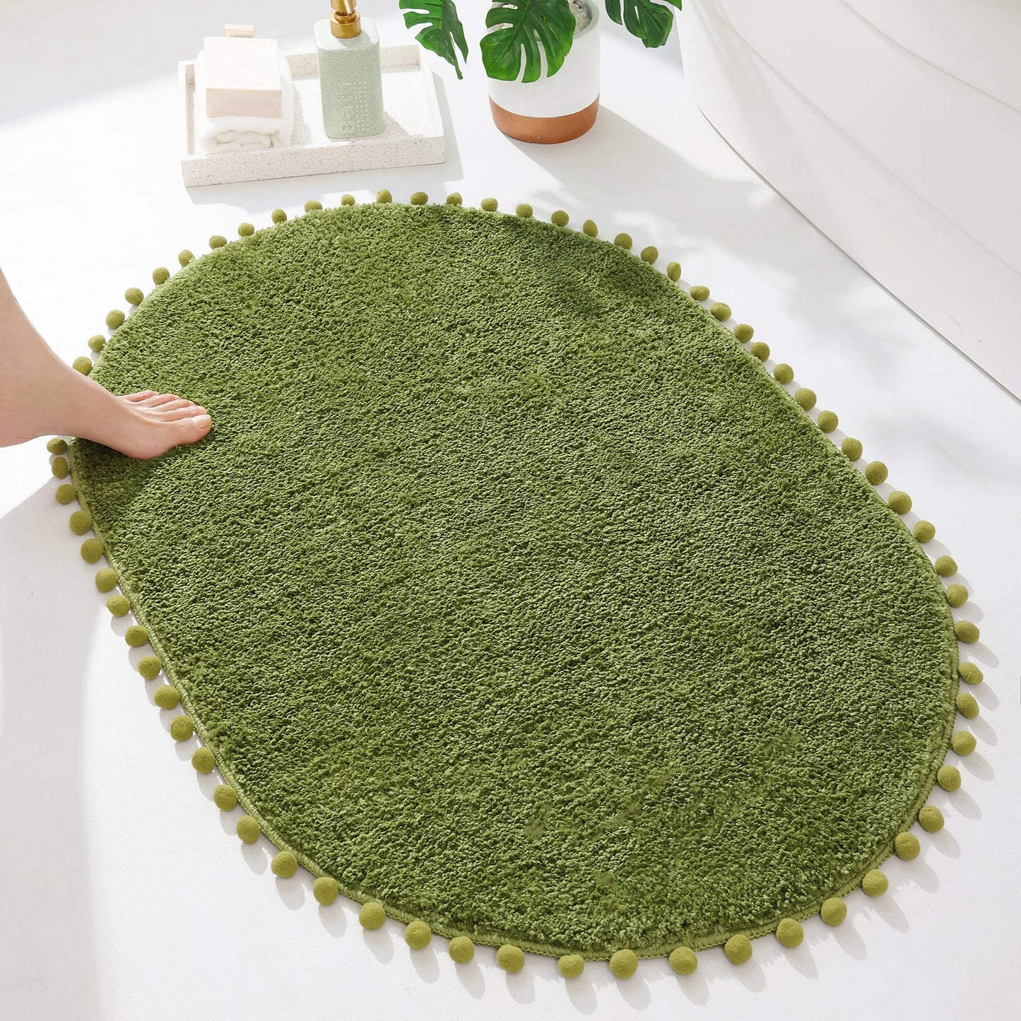 YIRDDEO Bath Mat Olive Green Oval Rug with Pom Bathroom Rugs for Bedroom Non Slip Cute Boho Absorbent Mats Soft Plush Washable Rug (24x36 inches)
