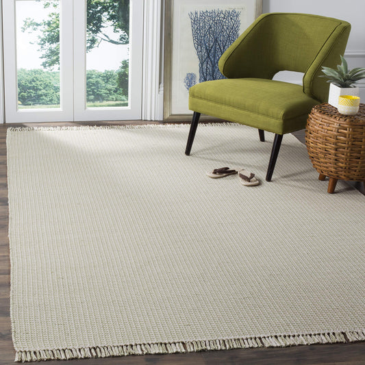 SAFAVIEH Montauk Collection Area Rug - 6' x 9', Ivory & Green, Handmade Flat Weave Boho Farmhouse Cotton Tassel Fringe, Ideal for High Traffic Areas in Living Room, Bedroom (MTK340G)