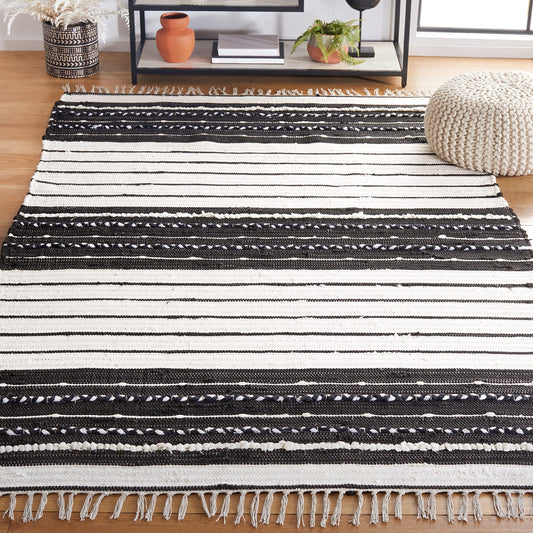 SAFAVIEH Striped Kilim Collection Accent Rug - 4' x 6', Black & Ivory, Flat Weave Boho Tassel Fringe Cotton Design, Easy Care, Ideal for High Traffic Areas in Entryway, Living Room, Bedroom (STK207Z)
