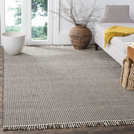 SAFAVIEH Montauk Collection Area Rug - 5' x 8', Ivory & Black, Handmade Flat Weave Boho Farmhouse Cotton Tassel Fringe, Ideal for High Traffic Areas in Living Room, Bedroom (MTK340D)